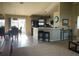 Open-concept living space with bar seating, stainless steel appliances, and natural light at 8187 Sw 60Th Ter, Ocala, FL 34476