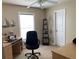 Functional office space with a large window for natural light and ample room for a desk and shelving at 8187 Sw 60Th Ter, Ocala, FL 34476