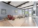 Inviting living room featuring a sectional sofa, ceiling fan, with seamless transition to the outdoor balcony at 8436 Tavistock Lakes Boulevard, Orlando, FL 32827