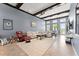 Bright and airy living room showcasing high ceilings, neutral decor, and large windows at 8436 Tavistock Lakes Boulevard, Orlando, FL 32827