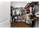 Spacious walk-in closet with custom shelving and ample storage for clothing and accessories at 8436 Tavistock Lakes Boulevard, Orlando, FL 32827
