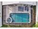 Aerial view of pool shows the hot tub, pool and lounge area at 941 Clear Creek Cir, Clermont, FL 34714