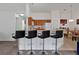 A look at the kitchen breakfast bar with wood cabinets and white appliances at 941 Clear Creek Cir, Clermont, FL 34714