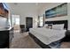 Main bedroom with ensuite bathroom and large beach-themed artwork on the wall at 941 Clear Creek Cir, Clermont, FL 34714