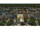 Aerial view of a well-maintained home with a two-car garage and landscaped front yard in a suburban neighborhood at 9836 Lake District Ln, Orlando, FL 32832