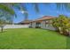 Spacious backyard showcasing well-maintained lawn, privacy fence, and a serene setting at 9836 Lake District Ln, Orlando, FL 32832