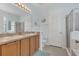 Bathroom with double sinks and plenty of counter space; separate shower is featured at 9836 Lake District Ln, Orlando, FL 32832