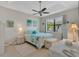 Comfortable bedroom featuring a ceiling fan and a view of the outside at 9836 Lake District Ln, Orlando, FL 32832