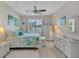 Cozy bedroom with tray ceiling, ceiling fan, and plenty of natural light at 9836 Lake District Ln, Orlando, FL 32832