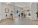 Elegant dining room with a glass table, chandelier, and stylish decor at 9836 Lake District Ln, Orlando, FL 32832