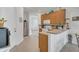 Well-lit kitchen with stainless steel refrigerator and plenty of cabinet space at 9836 Lake District Ln, Orlando, FL 32832