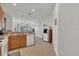 Bright and modern kitchen that opens into the living area with tile flooring at 9836 Lake District Ln, Orlando, FL 32832