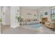 Cozy living room with light color palette, tile flooring, and ample natural light at 9836 Lake District Ln, Orlando, FL 32832