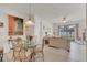 Open-concept living and dining area with stylish furnishings and backyard view at 9836 Lake District Ln, Orlando, FL 32832