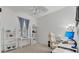 Home office or den offers built-in shelving, a comfortable workspace, and natural light at 9836 Lake District Ln, Orlando, FL 32832