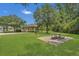 Open-air pavilion with picnic tables and benches, set in a grassy park with mature trees, perfect for outdoor gatherings at 9836 Lake District Ln, Orlando, FL 32832