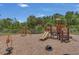 A colorful playground with slides and climbing structures, surrounded by lush greenery and providing a fun space for  at 9836 Lake District Ln, Orlando, FL 32832