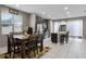Open kitchen and dining area with stainless appliances and granite counters at 1165 Stratton Ave, Groveland, FL 34736