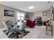 Open living room features tile floors and comfortable seating arrangement at 1165 Stratton Ave, Groveland, FL 34736