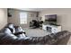 Cozy living room with comfortable seating and a large-screen television at 1165 Stratton Ave, Groveland, FL 34736