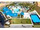 Aerial view showcasing the community clubhouse, water park, basketball court, and sand volleyball at 1283 Blue Paradise Way, Clermont, FL 34714