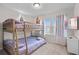 bunk room featuring a sturdy wooden bunkbed and plenty of natural light at 1283 Blue Paradise Way, Clermont, FL 34714