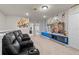 A bonus room features built-in theater chairs, themed decor and a large television at 1283 Blue Paradise Way, Clermont, FL 34714