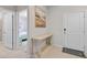 Inviting entryway with neutral tones, stylish console table, and access to a bedroom at 1283 Blue Paradise Way, Clermont, FL 34714