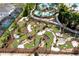 Enjoy a fun round on the well-maintained mini golf course with palm trees and paved pathways at 1283 Blue Paradise Way, Clermont, FL 34714