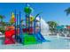 Vibrant splash pad featuring colorful slides and water features for Gathering fun on a sunny day at 1283 Blue Paradise Way, Clermont, FL 34714