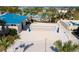 A community volleyball court with well-maintained sand and landscaping at 1283 Blue Paradise Way, Clermont, FL 34714
