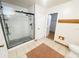 Bathroom featuring glass-enclosed shower and a toilet at 13046 Prairie Meadows Dr, Orlando, FL 32837