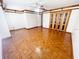 Bedroom featuring wooden floors, a ceiling fan, and large wooden closet doors at 13046 Prairie Meadows Dr, Orlando, FL 32837