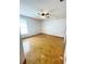 Spacious bedroom featuring a ceiling fan, parquet floors, and neutral walls providing a calm atmosphere at 13046 Prairie Meadows Dr, Orlando, FL 32837