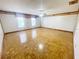 Spacious bedroom featuring parquet flooring, neutral walls, and bright windows at 13046 Prairie Meadows Dr, Orlando, FL 32837