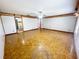 Spacious bedroom featuring parquet flooring, neutral walls, and bright windows at 13046 Prairie Meadows Dr, Orlando, FL 32837