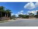 Kempton Park community entrance featuring brick signage, landscaping, and a well-maintained street at 13046 Prairie Meadows Dr, Orlando, FL 32837