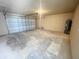Spacious garage with a roll-up door and bare walls at 13046 Prairie Meadows Dr, Orlando, FL 32837