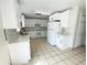 Bright, updated kitchen featuring white cabinetry, countertops, and modern appliances, providing a functional space at 13046 Prairie Meadows Dr, Orlando, FL 32837