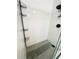 Modern tiled shower with glass door and built-in shelves at 13046 Prairie Meadows Dr, Orlando, FL 32837
