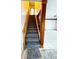 Carpeted stairway with wood handrail, banister, and detailed post at 13046 Prairie Meadows Dr, Orlando, FL 32837