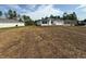 An exterior view of a one-story home that needs to be landscaped at 13265 Sw 85Th Cir, Ocala, FL 34473