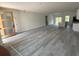A spacious living room with wood-look vinyl floors offering an open concept layout at 13265 Sw 85Th Cir, Ocala, FL 34473