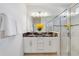 Elegant bathroom with double vanity, granite countertop, and a glass-enclosed shower at 1396 Riley Cir, Deland, FL 32724