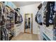 Walk-in closet with built in shelving, drawers, ample storage space for clothes, and a full length mirror at 1396 Riley Cir, Deland, FL 32724