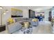 Spacious living room featuring a comfortable sectional sofa, stylish decor, and access to the outdoors at 1396 Riley Cir, Deland, FL 32724