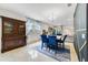 Inviting living room with elegant blue accents and an open layout connecting to the dining area at 1396 Riley Cir, Deland, FL 32724