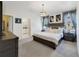 Spacious main bedroom featuring a comfortable bed and ensuite bathroom at 1396 Riley Cir, Deland, FL 32724