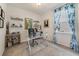 Cozy office with a glass desk, neutral paint color, carpet floors, and natural light from the window at 1396 Riley Cir, Deland, FL 32724