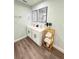 Modern bathroom with double sinks, granite countertops, and minimalist decor at 14 Fir Trail Way, Ocala, FL 34472